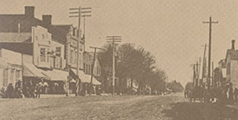 Lakeshore Rd. in 1900 with telegraph poles on one side and hydro poles on the other.
