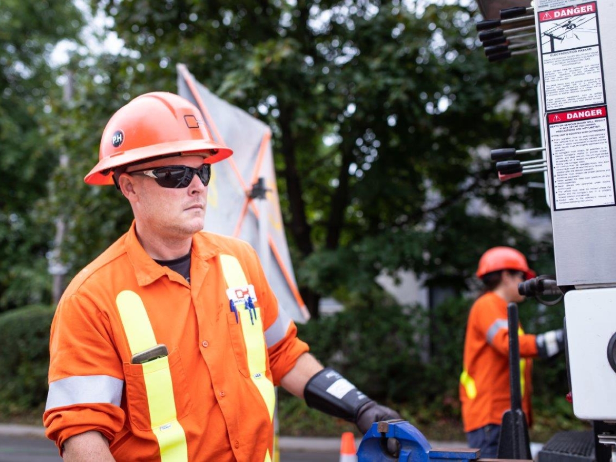 Pair of powerline technicians working in the community.